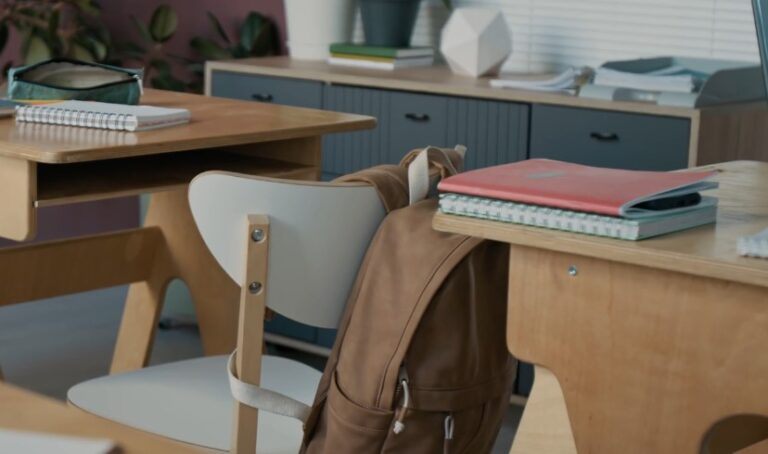 Student backpack suspended on a classroom chair