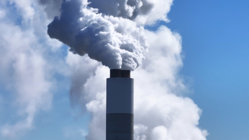 Factory smoke shows emissions tied to the Foreign Pollution Fee Act’s impact on U.S. businesses