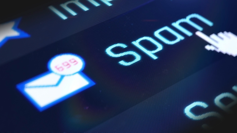 Close-up of an inbox flooded with spam messages, representing bulk email abuse and deceptive routing